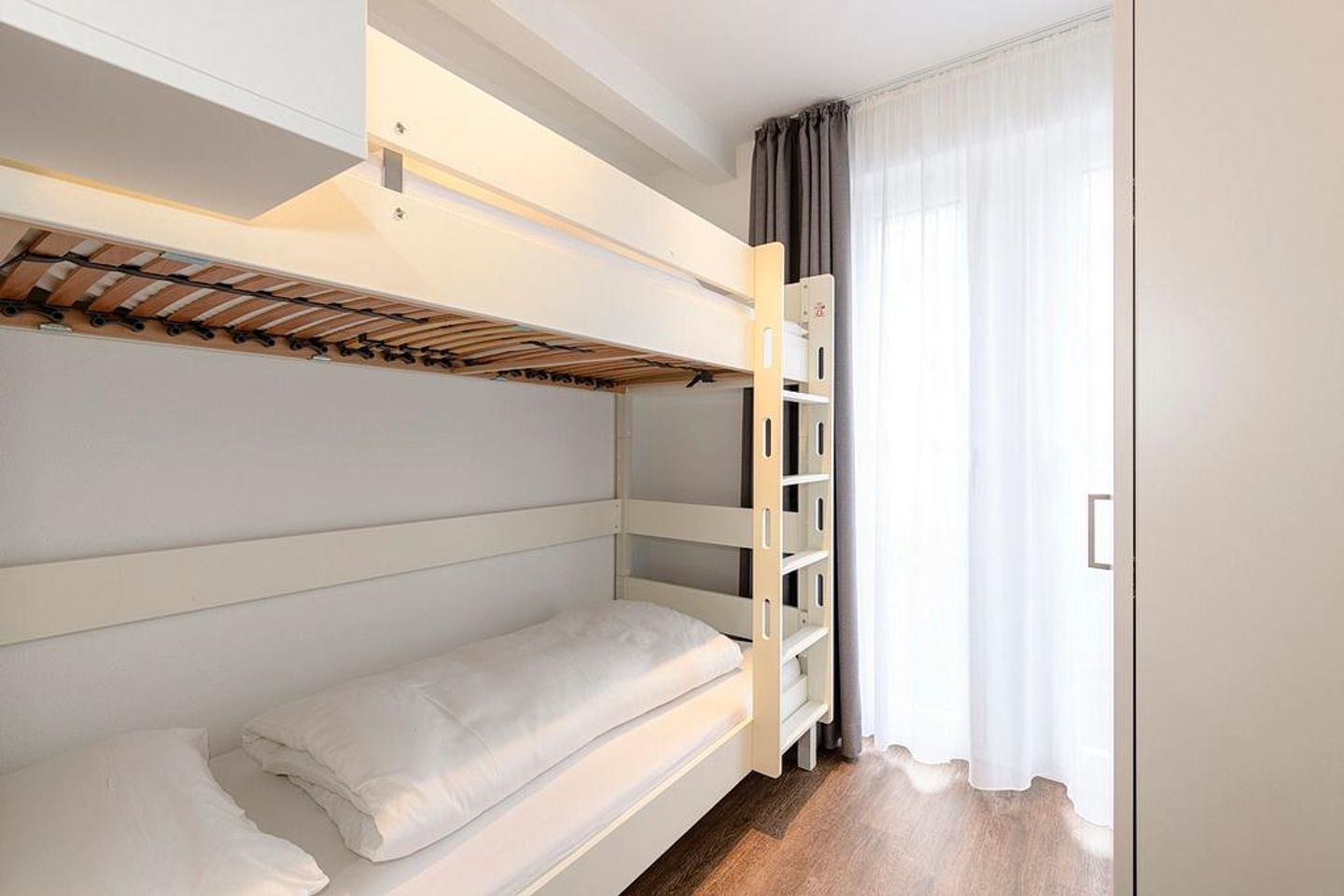 Deichhäuser Anna Küste Deichhäuser Anna Küste 1-20 Bensersiel - Schlafzimmer mit Stapelbett