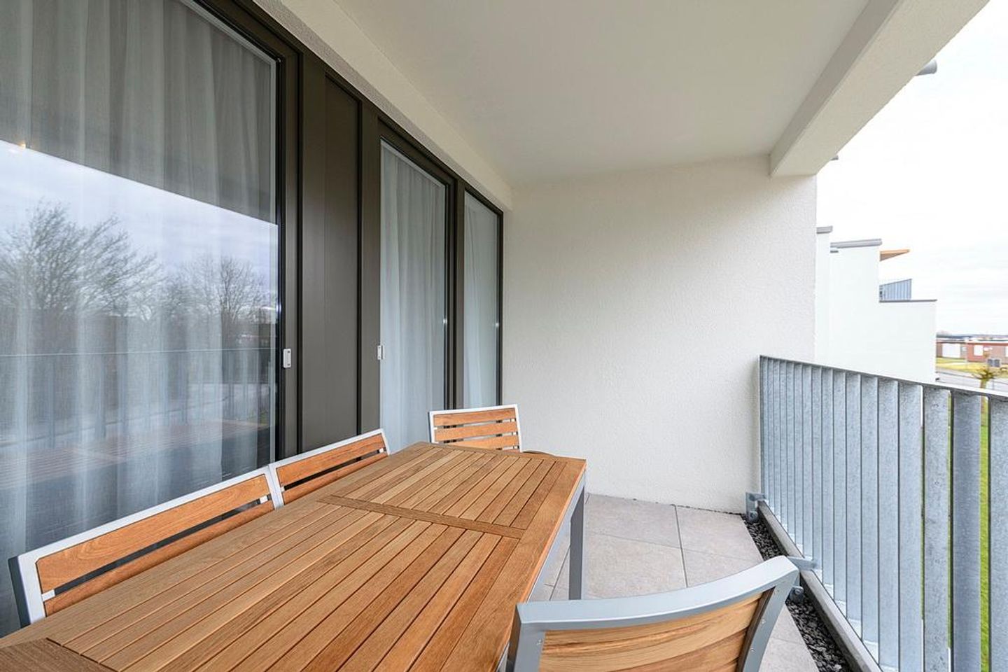 Deichhäuser Anna Küste Deichhäuser Anna Küste 1-20 Bensersiel - Balkon mit Sitzgelegenheiten