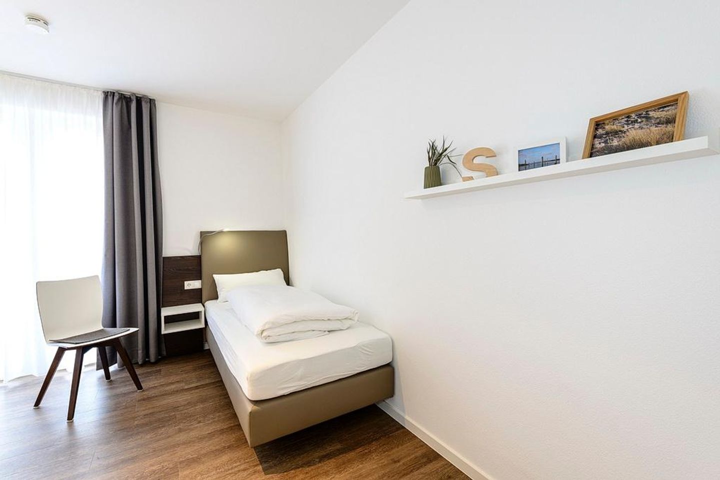 Deichhäuser Anna Küste Deichhäuser Anna Küste 1-24 Bensersiel - Schlafzimmer mit Einzelbetten