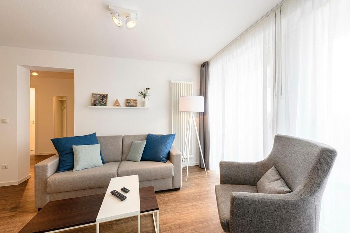 Deichhäuser Anna Küste Deichhäuser Anna Küste 1-31 Bensersiel - Wohn/Essbereich mit Sessel und Couch