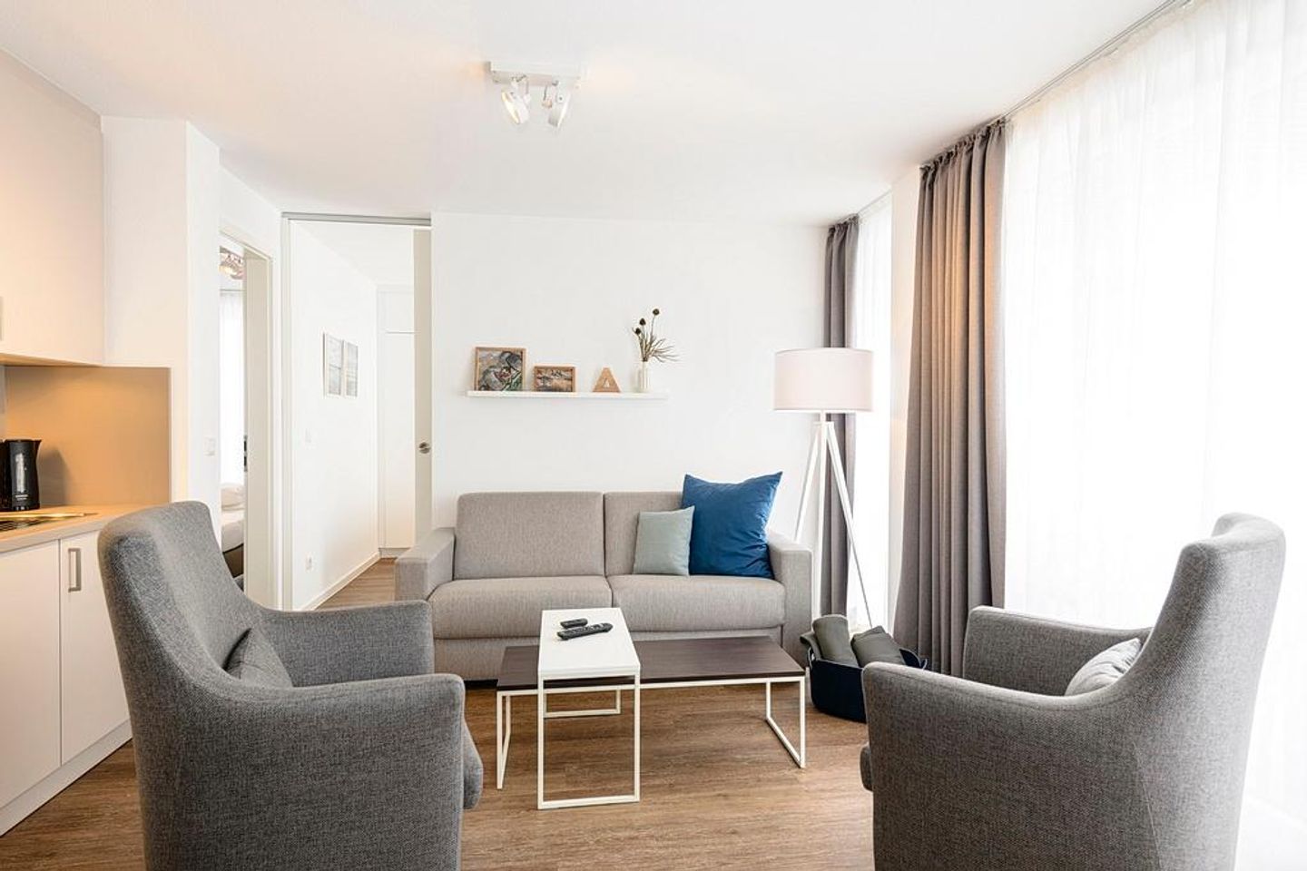 Deichhäuser Anna Küste Deichhäuser Anna Küste 1-33 Bensersiel - Wohn/Essbereich mit Couch und Sesseln