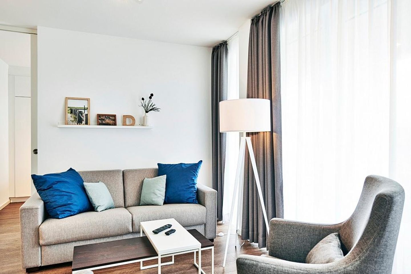 Deichhäuser Anna Küste Deichhäuser Anna Küste 2-13 Bensersiel - Wohn/Essbereich mit Couch und Sessel