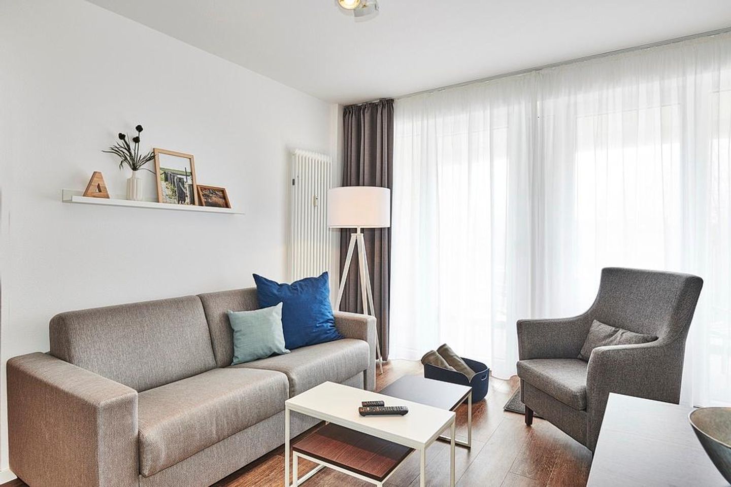 Deichhäuser Anna Küste Deichhäuser Anna Küste 2-21 Bensersiel - Wohn/Essbereich mit Couch und Sessel