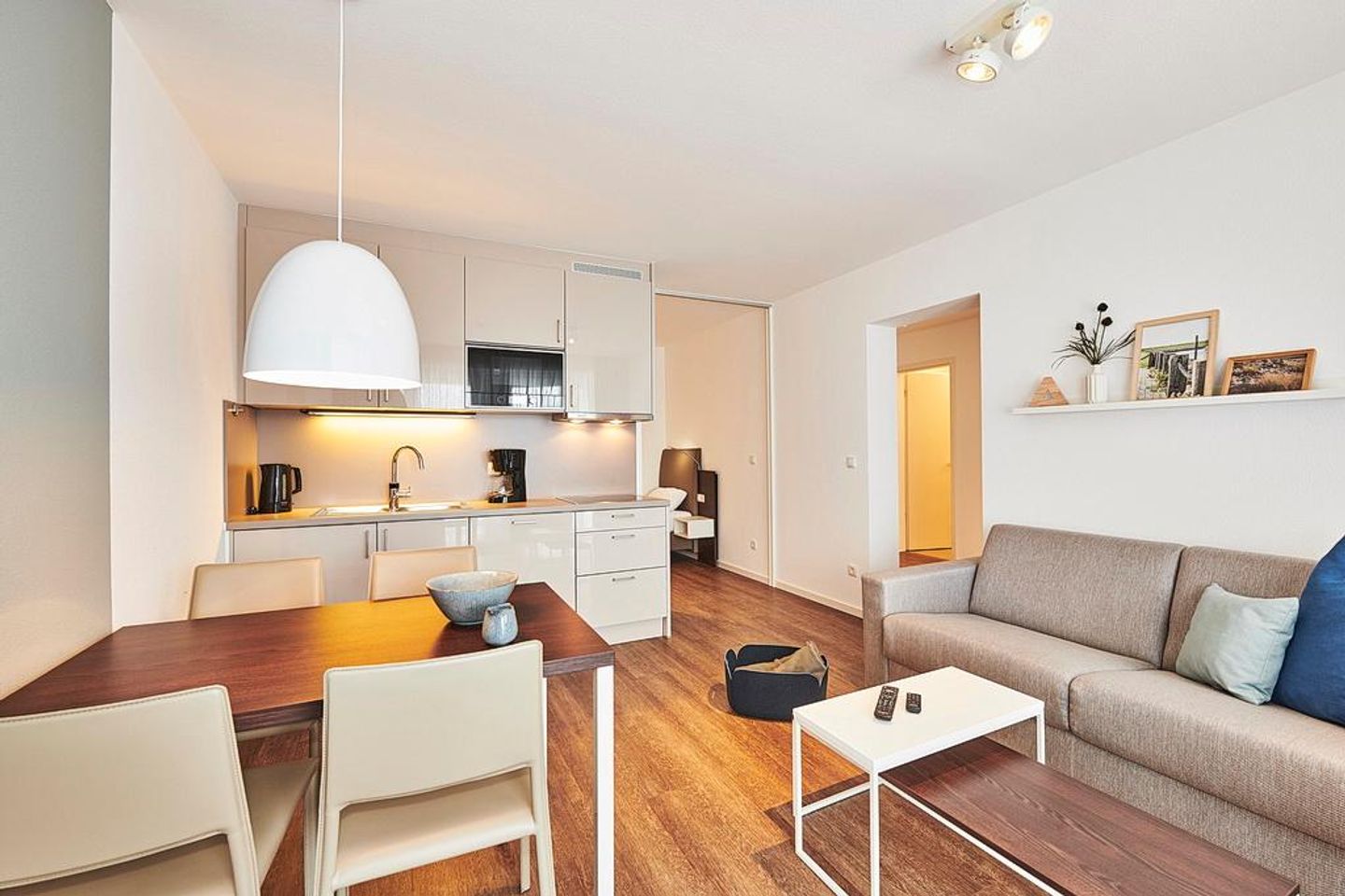 Deichhäuser Anna Küste Deichhäuser Anna Küste 2-21 Bensersiel - Wohn/Essbereich mit Couch und Sessel