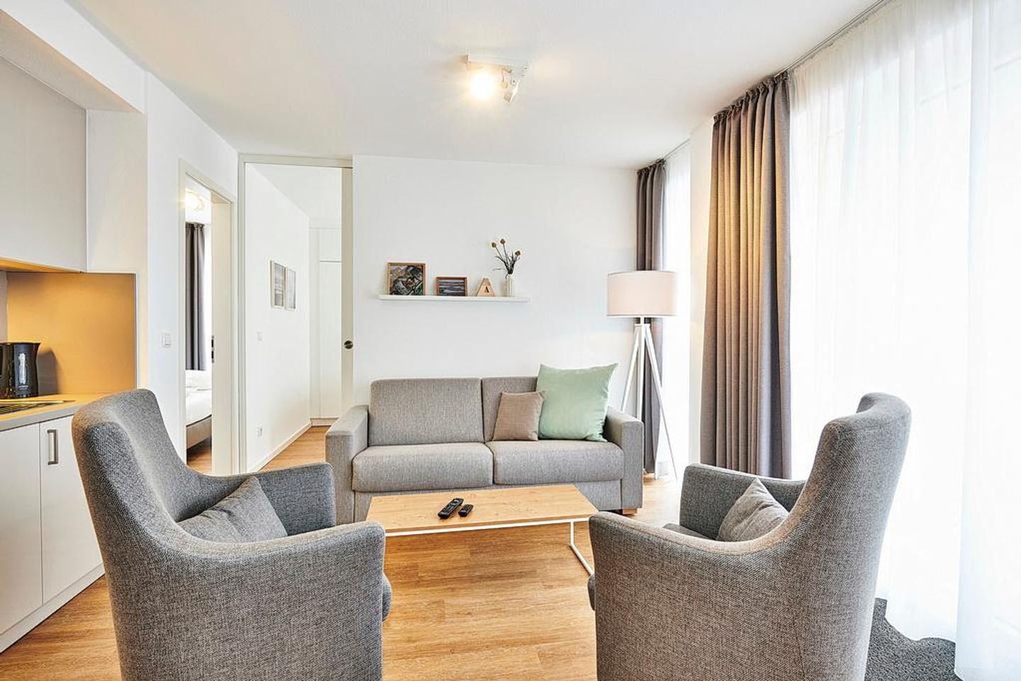 Deichhäuser Anna Küste Deichhäuser Anna Küste 2-23 Bensersiel - Wohn/Essbereich mit Couch und Sesseln