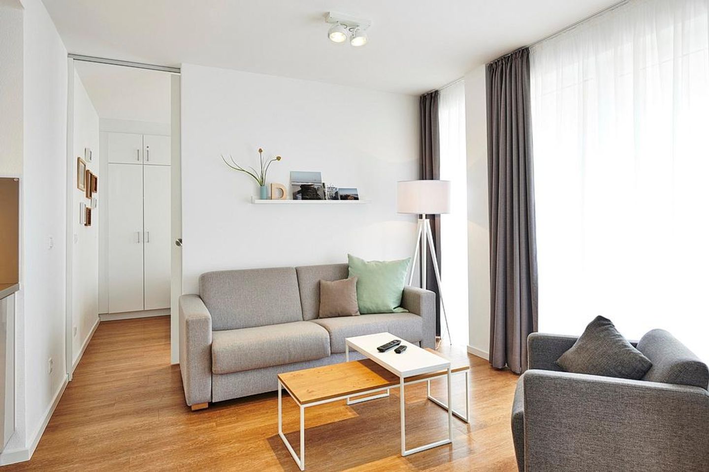 Deichhäuser Anna Küste Deichhäuser Anna Küste 3-13 Bensersiel - Wohnbereich mit Couch, Sessel