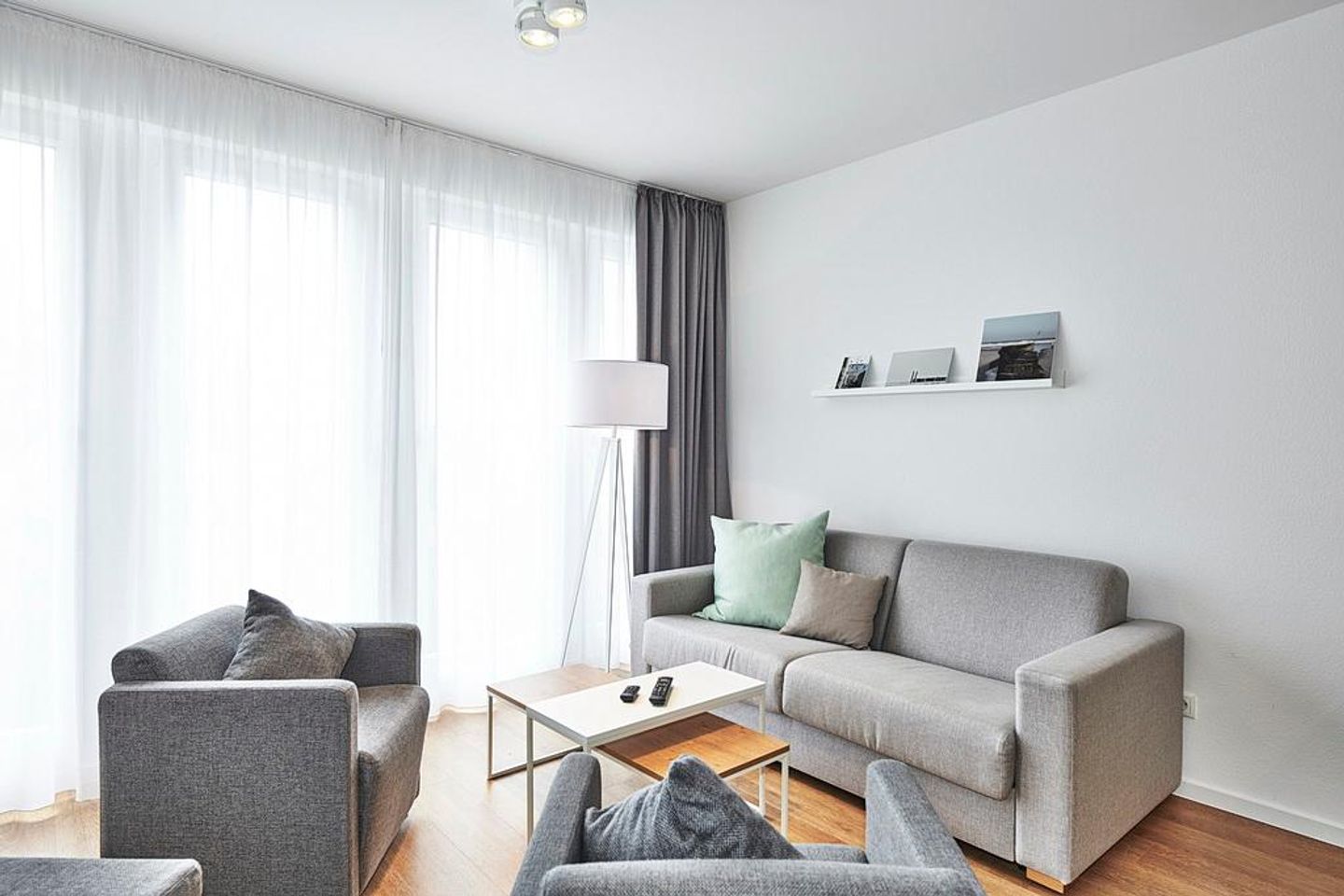 Deichhäuser Anna Küste Deichhäuser Anna Küste 3-14 Bensersiel - Wohnbereich mit Couch und Sesseln