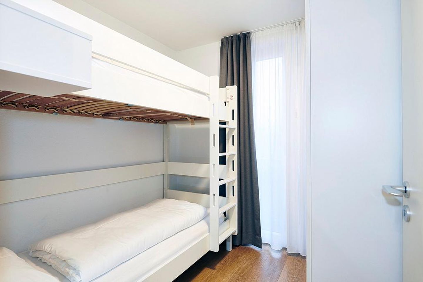 Deichhäuser Anna Küste Deichhäuser Anna Küste 3-30 Bensersiel - Schlafzimmer mit Etagenbett