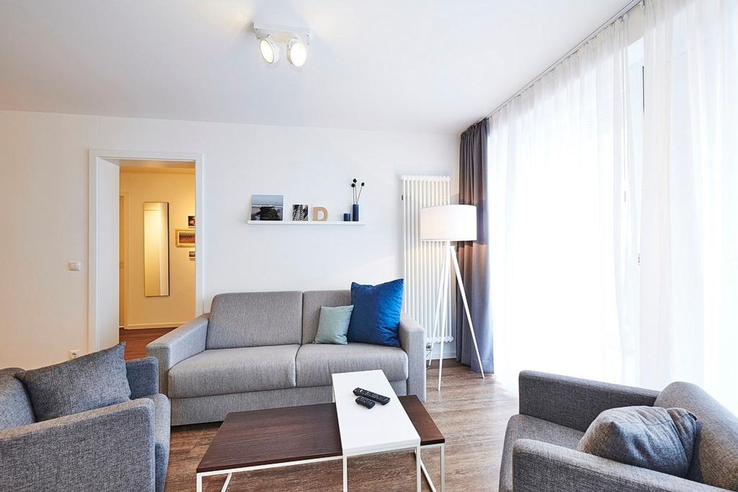 Deichhäuser Anna Küste Deichhäuser Anna Küste 3-31 Bensersiel - Wohnbereich mit Couch und Sesseln