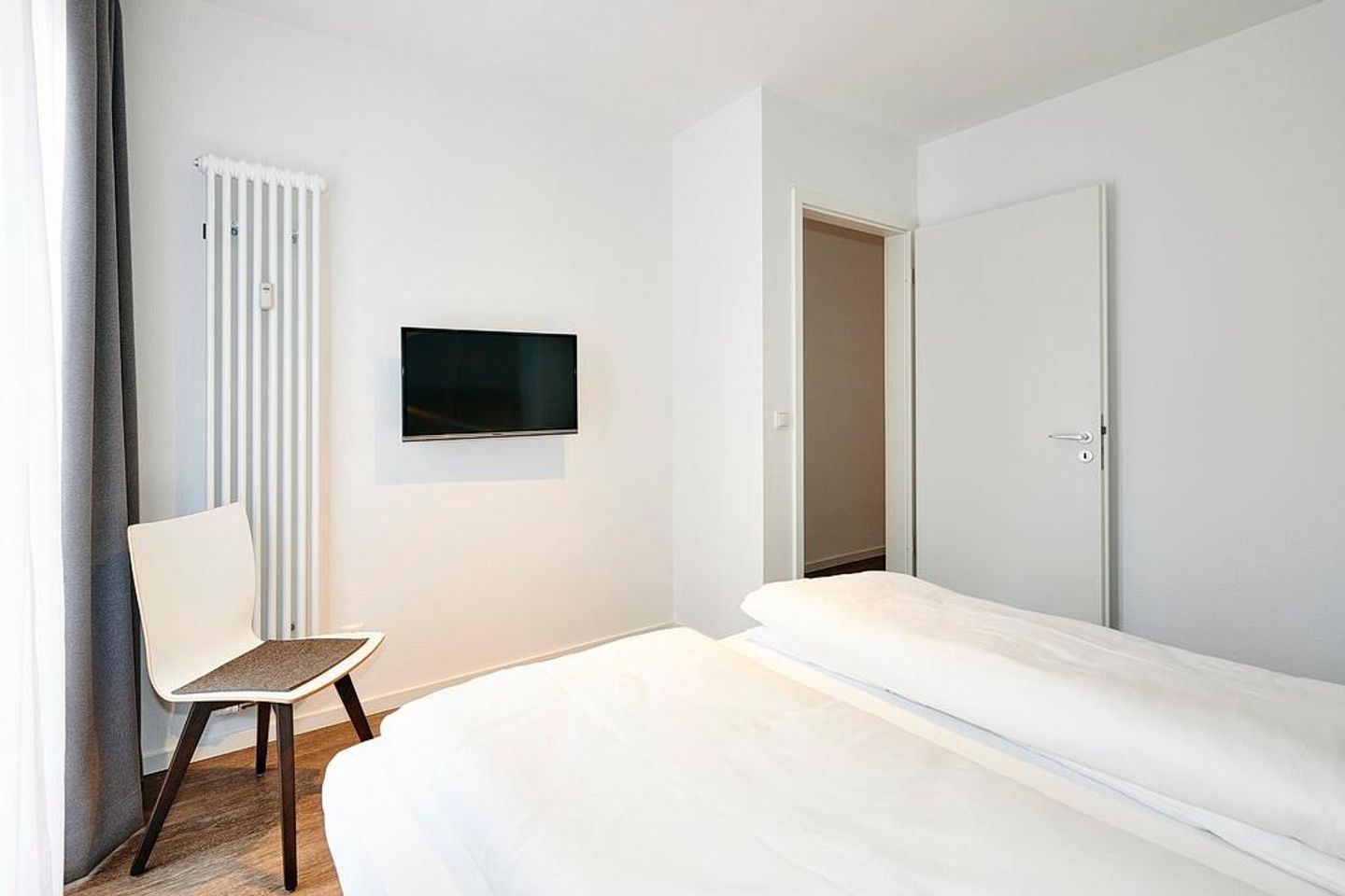 Deichhäuser Anna Küste Deichhäuser Anna Küste 4-10 Bensersiel - Schlafzimmer mit Doppelbett