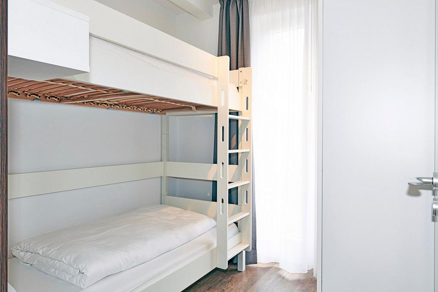 Deichhäuser Anna Küste Deichhäuser Anna Küste 4-10 Bensersiel - Schlafzimmer mit Etagenbett