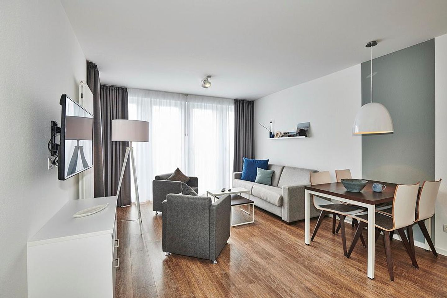 Deichhäuser Anna Küste Deichhäuser Anna Küste 4-34 Bensersiel - Wohn-Essbereich mit Couch, w