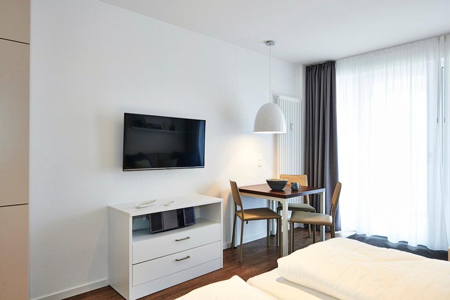 Deichhäuser Anna Küste Deichhäuser Anna Küste 3-22 Bensersiel - Wohnbereich mit Flatscreen-TV