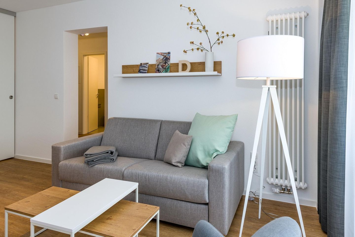 Deichhäuser Anna Küste Deichhäuser Anna Küste 6-21 Bensersiel - Wohn-Essbereich mit Couch