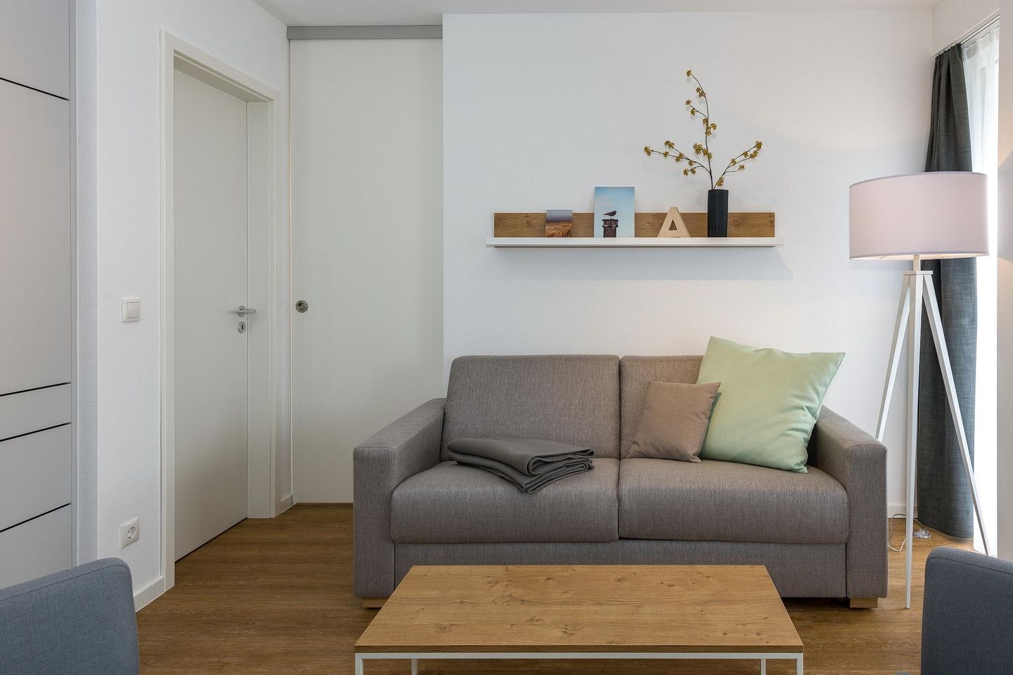 Deichhäuser Anna Küste Deichhäuser Anna Küste 6-23 Bensersiel - Wohnbereich mit Sitzgelegenheit