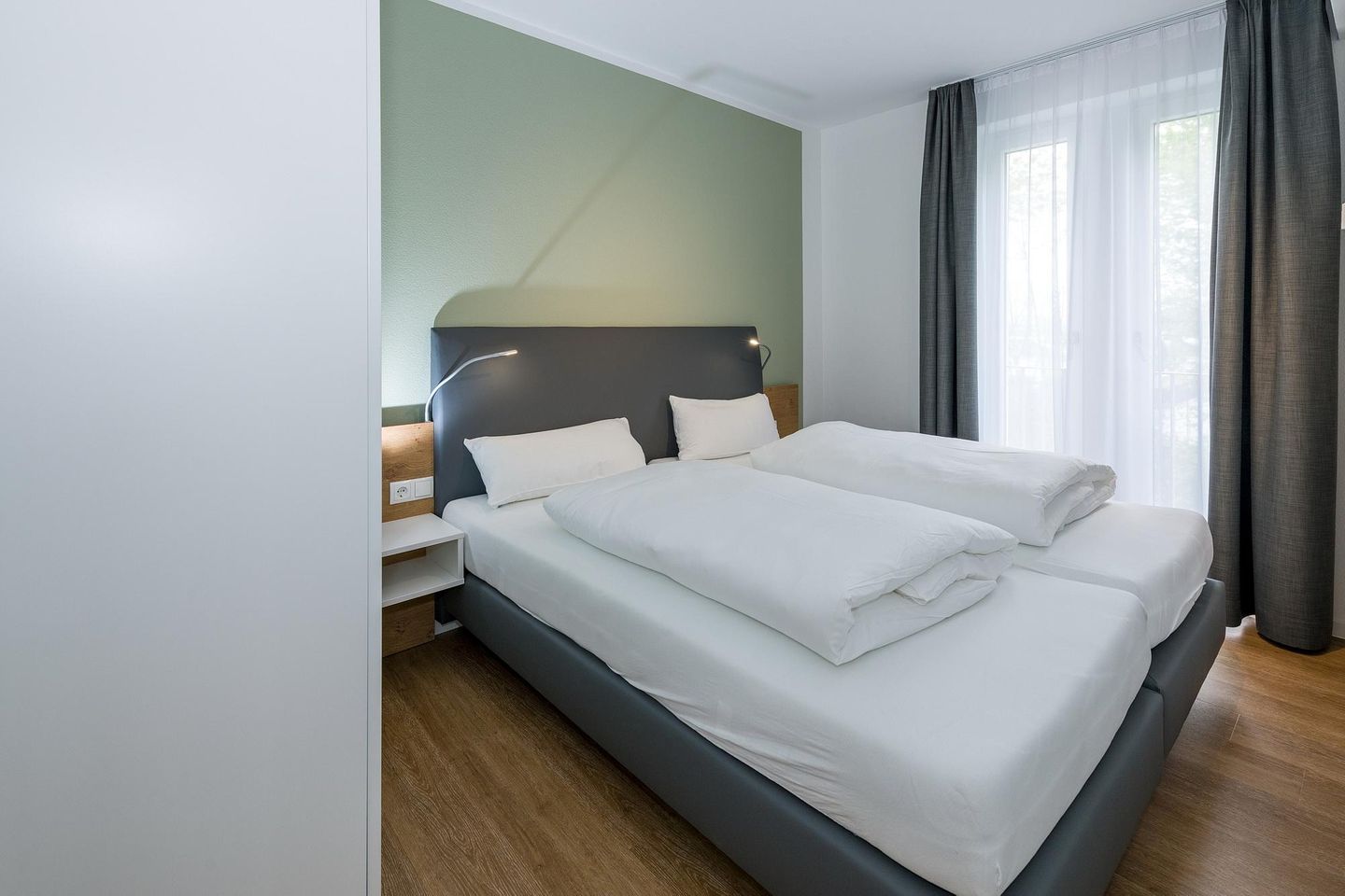 Deichhäuser Anna Küste Deichhäuser Anna Küste 6-23 Bensersiel - Schlafzimmer mit Doppelbett