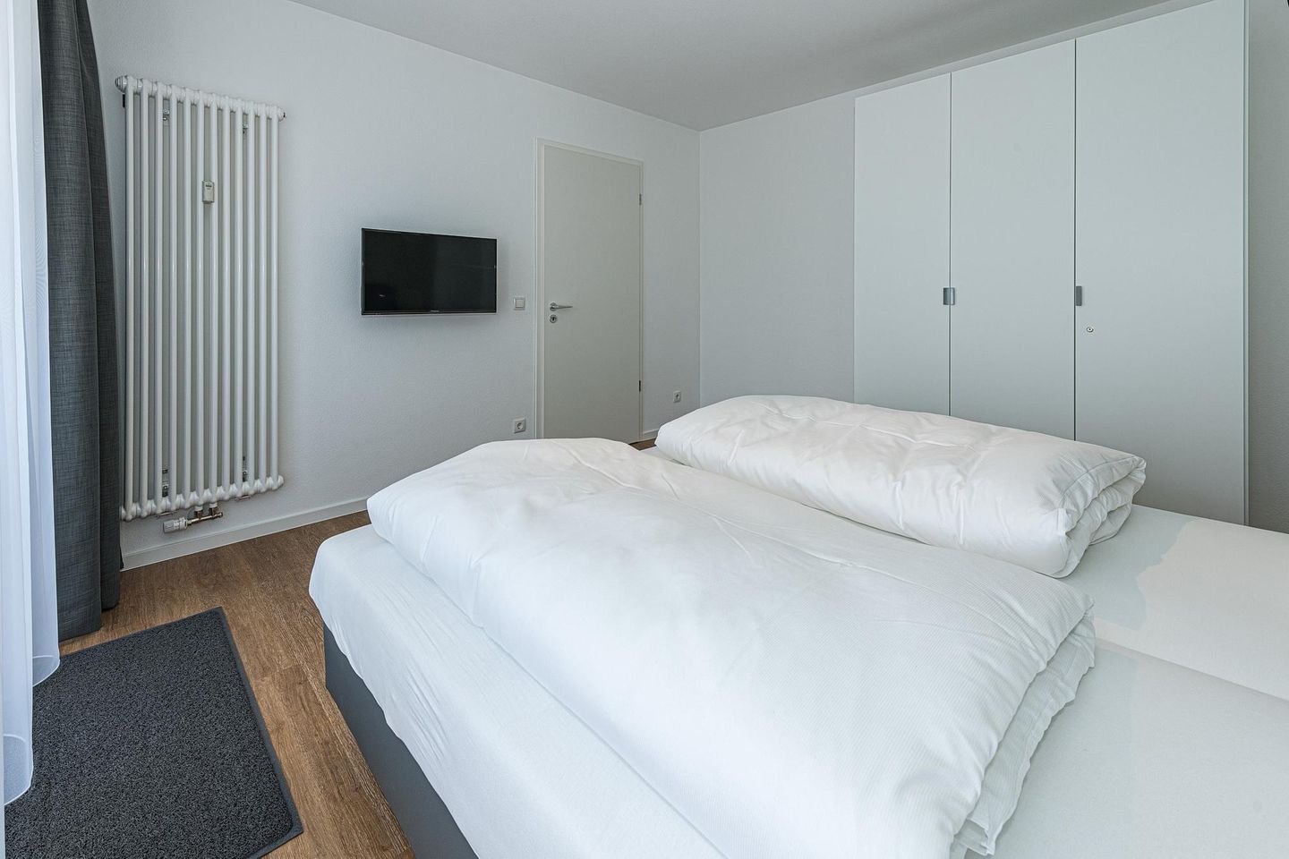 Deichhäuser Anna Küste Deichhäuser Anna Küste 7-24 Bensersiel - Schlafzimmer mit Doppelbett