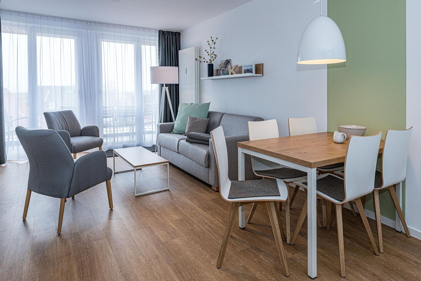 Deichhäuser Anna Küste Deichhäuser Anna Küste 7-30 Bensersiel - Wohn-Essbereich mit Couch