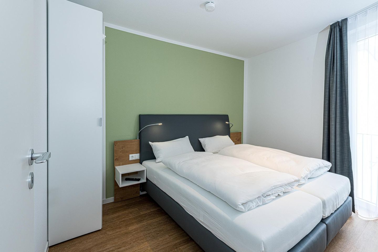 Deichhäuser Anna Küste Deichhäuser Anna Küste 7-30 Bensersiel - Schlafzimmer mit Doppelbett