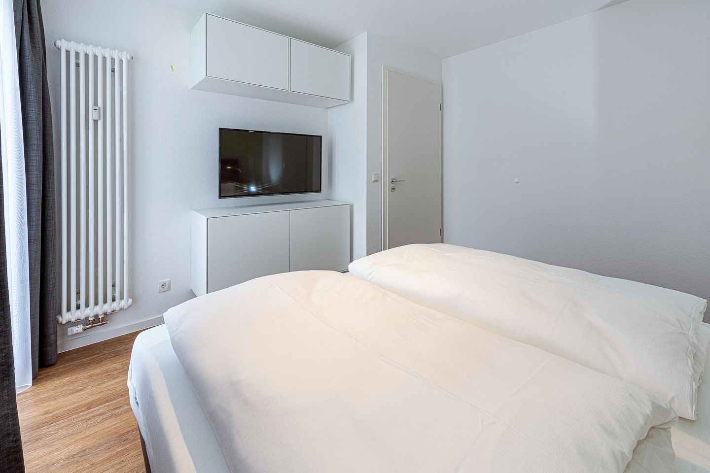 Deichhäuser Anna Küste Deichhäuser Anna Küste 7-30 Bensersiel - Wohn-Essbereich mit Couch