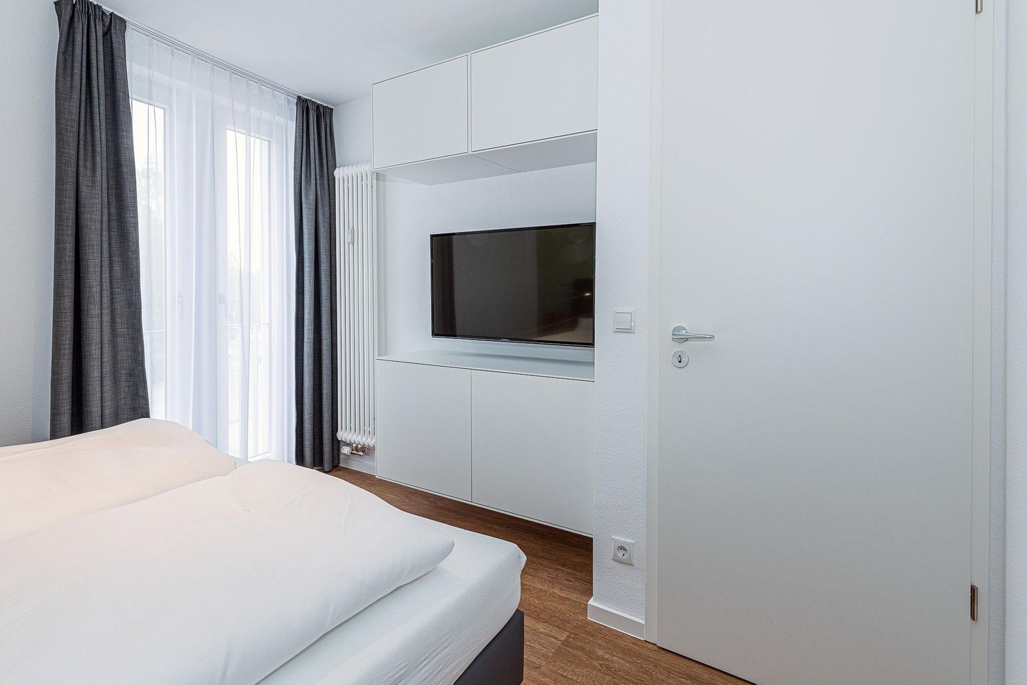 Deichhäuser Anna Küste Deichhäuser Anna Küste 7-30 Bensersiel - Wohn-Essbereich mit Couch