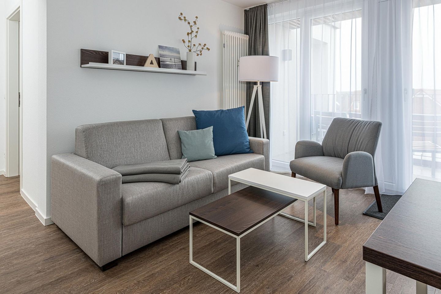 Deichhäuser Anna Küste Deichhäuser Anna Küste 7-31 Bensersiel - Wohn-Essbereich mit Couch