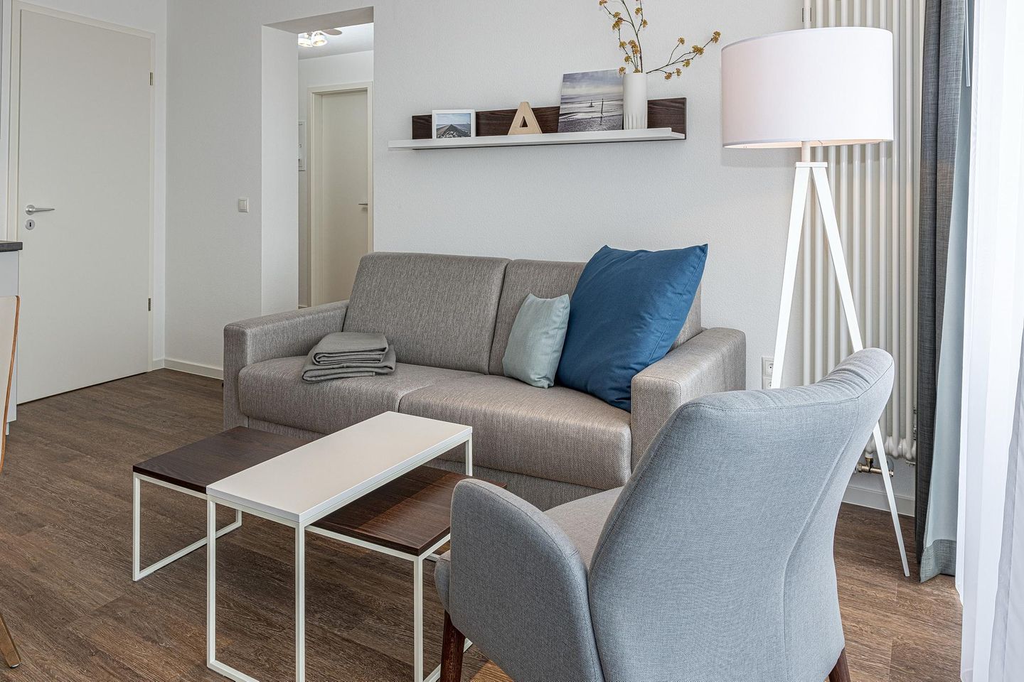 Deichhäuser Anna Küste Deichhäuser Anna Küste 7-31 Bensersiel - Wohn-Essbereich mit Couch