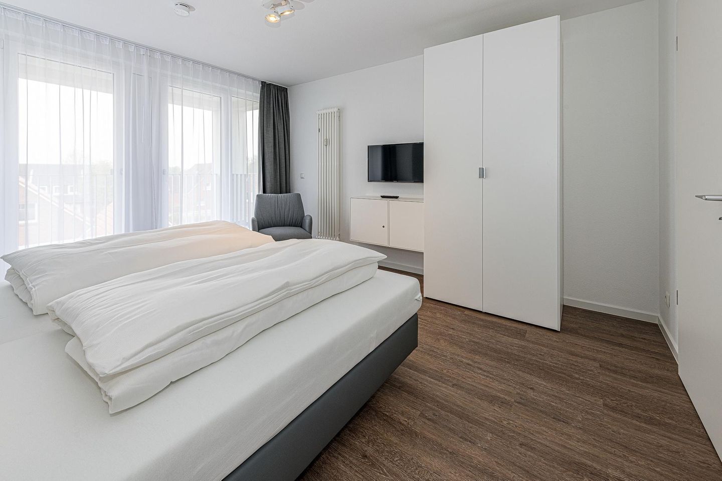 Deichhäuser Anna Küste Deichhäuser Anna Küste 7-31 Bensersiel - Wohn-Essbereich mit Couch