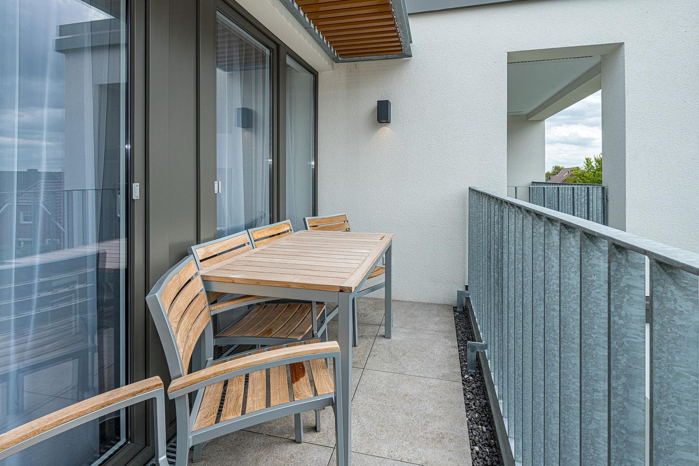 Deichhäuser Anna Küste Deichhäuser Anna Küste 7-31 Bensersiel - Überdachter Balkon mit Sitzgelegenheit