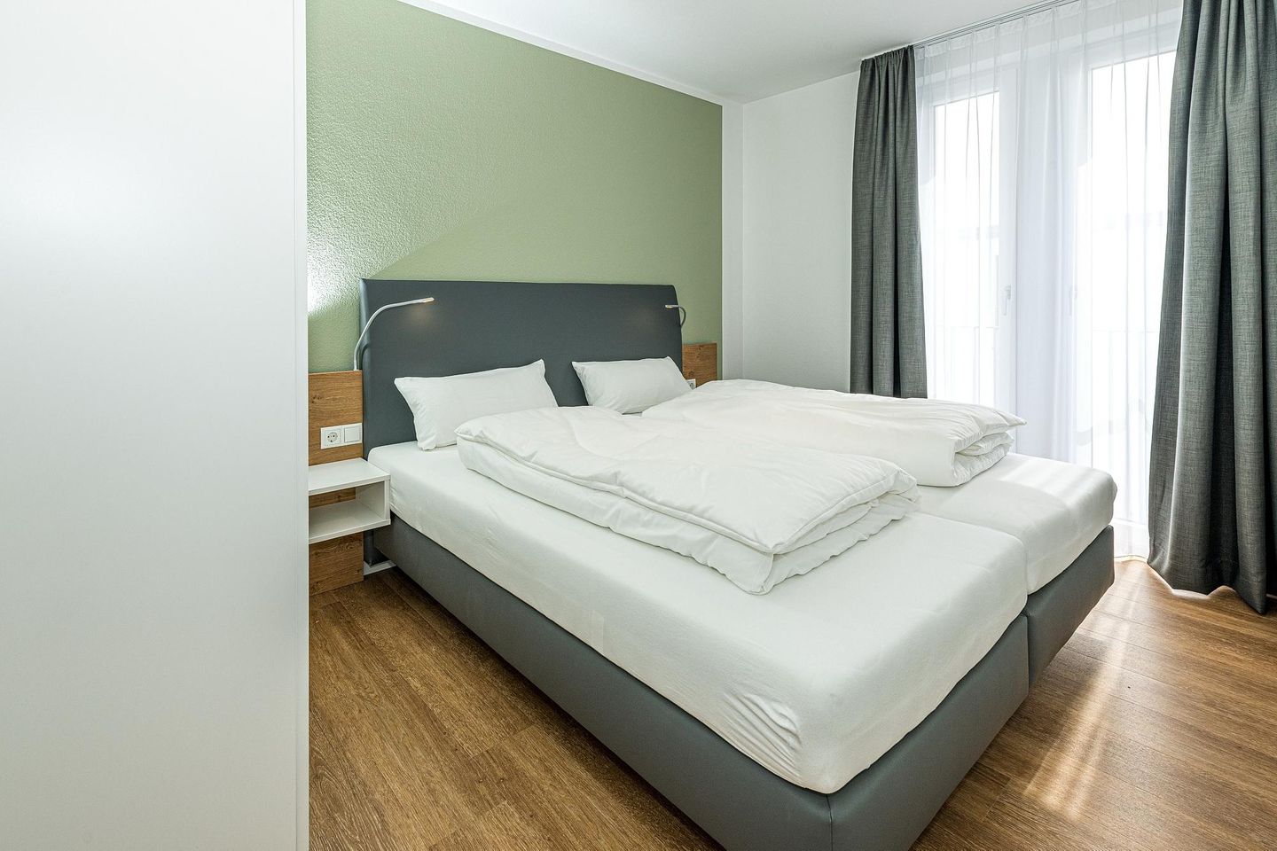 Deichhäuser Anna Küste Deichhäuser Anna Küste 7-33 Bensersiel - Schlafzimmer mit Doppelbett