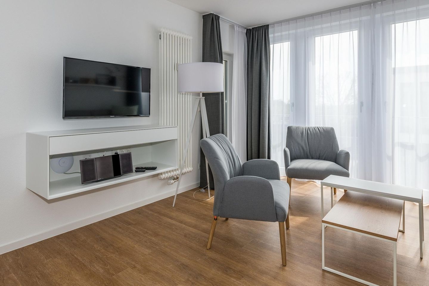 Deichhäuser Anna Küste Deichhäuser Anna Küste 7-34 Bensersiel - Wohn-Essbereich mit Couch