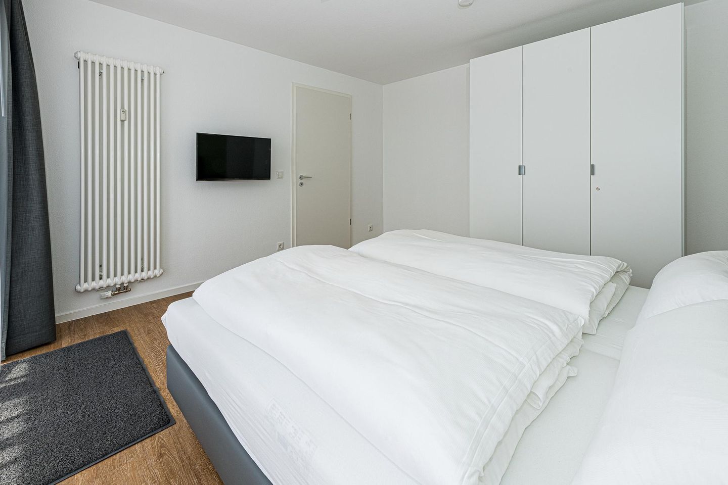 Deichhäuser Anna Küste Deichhäuser Anna Küste 7-34 Bensersiel - Schlafzimmer mit Doppelbett