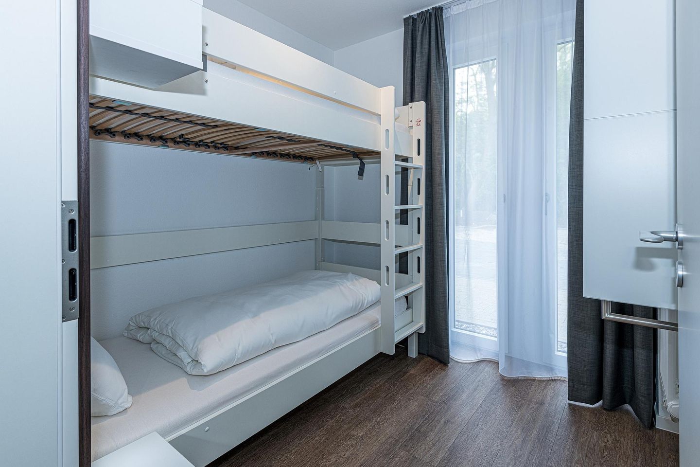 Deichhäuser Anna Küste Deichhäuser Anna Küste 8-10 Bensersiel - Schlafzimmer mit Etagenbett