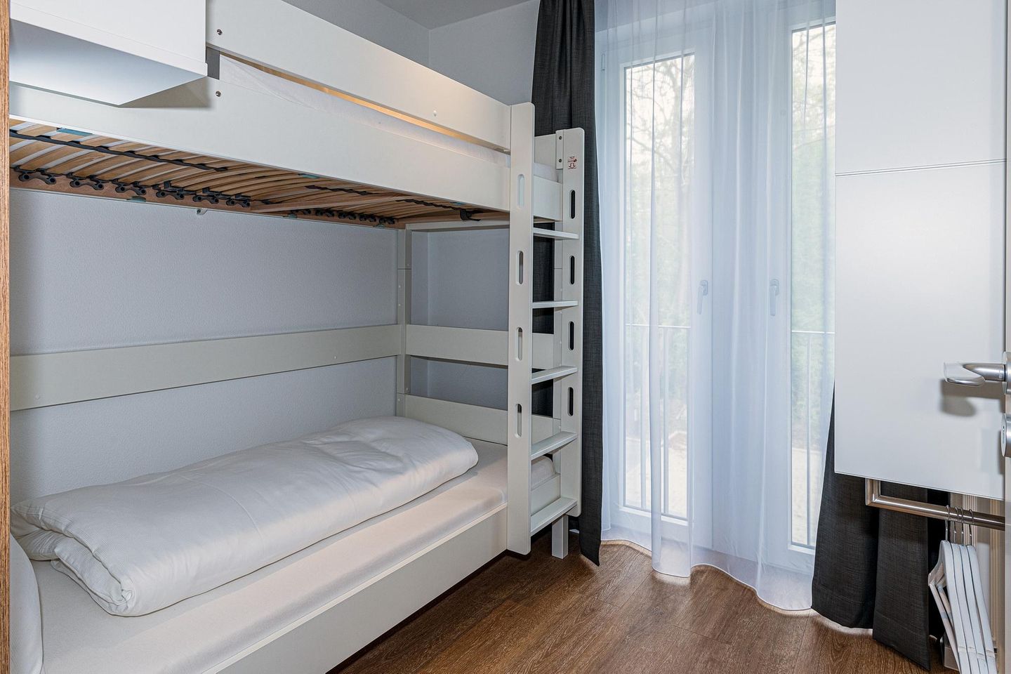 Deichhäuser Anna Küste Deichhäuser Anna Küste 8-20 Bensersiel - Schlafzimmer mit Etagenbett