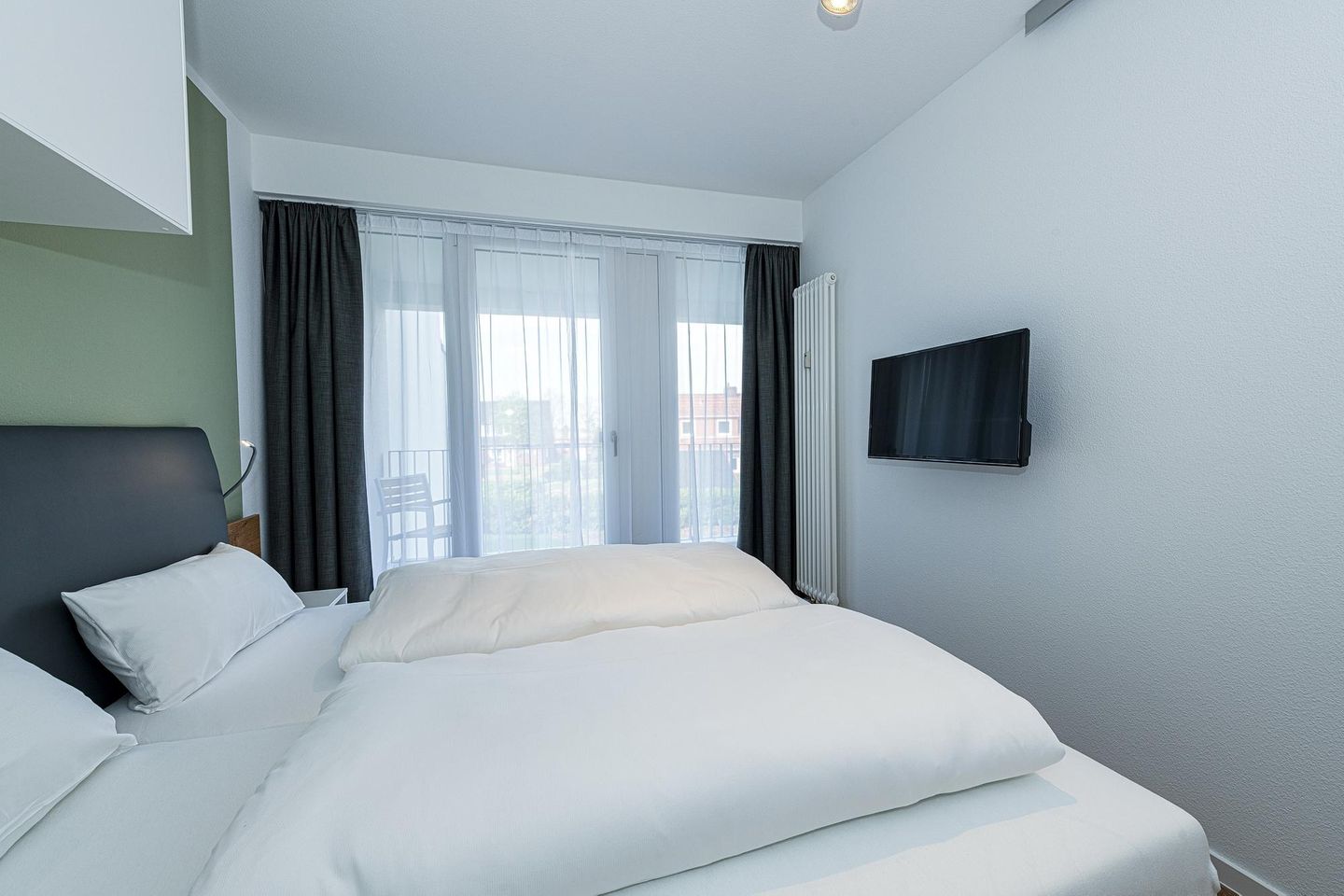 Deichhäuser Anna Küste Deichhäuser Anna Küste 8-23 Bensersiel - Schlafzimmer mit Doppelbett