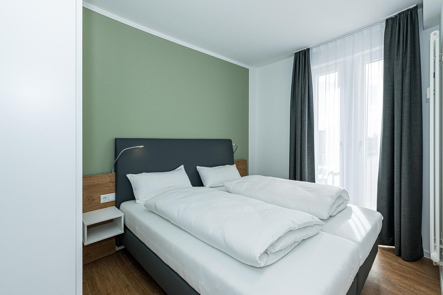 Deichhäuser Anna Küste Deichhäuser Anna Küste 8-23 Bensersiel - Schlafzimmer mit Doppelbett