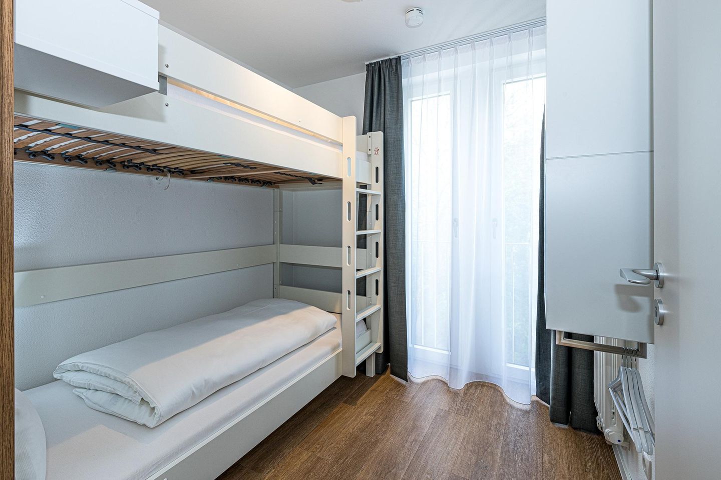 Deichhäuser Anna Küste Deichhäuser Anna Küste 8-30 Bensersiel - Schlafzimmer mit Etagenbett