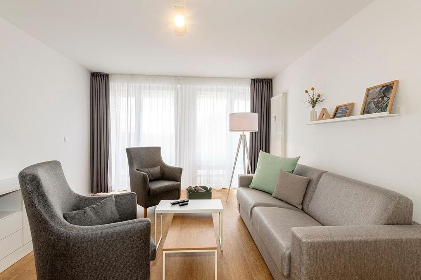 Deichhäuser Anna Küste Deichhäuser Anna Küste 1-30 Bensersiel - Wohn/Essbereich mit Couch und Sesseln