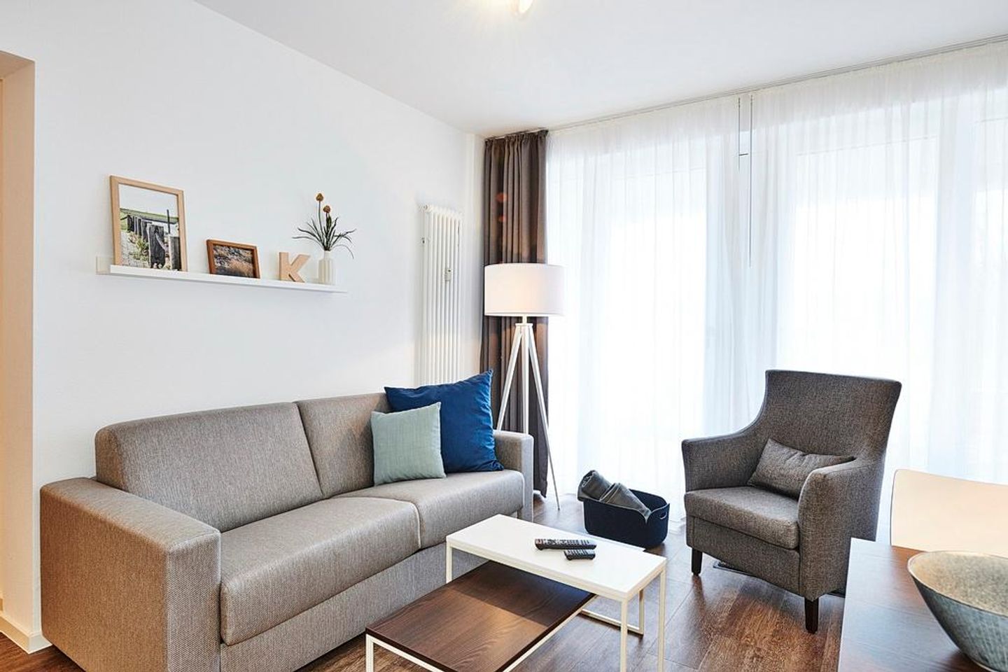 Deichhäuser Anna Küste Deichhäuser Anna Küste 2-11 Bensersiel - Wohn/Essbereich mit Couch und Sessel