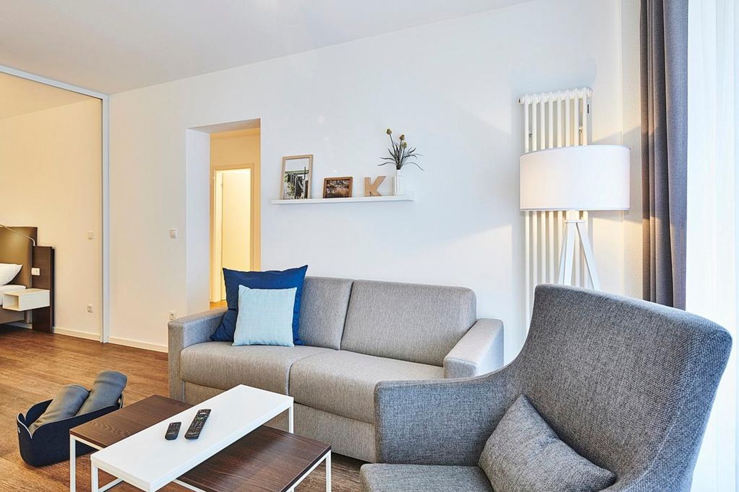 Deichhäuser Anna Küste Deichhäuser Anna Küste 2-11 Bensersiel - Wohn/Essbereich mit Sessel und Couch