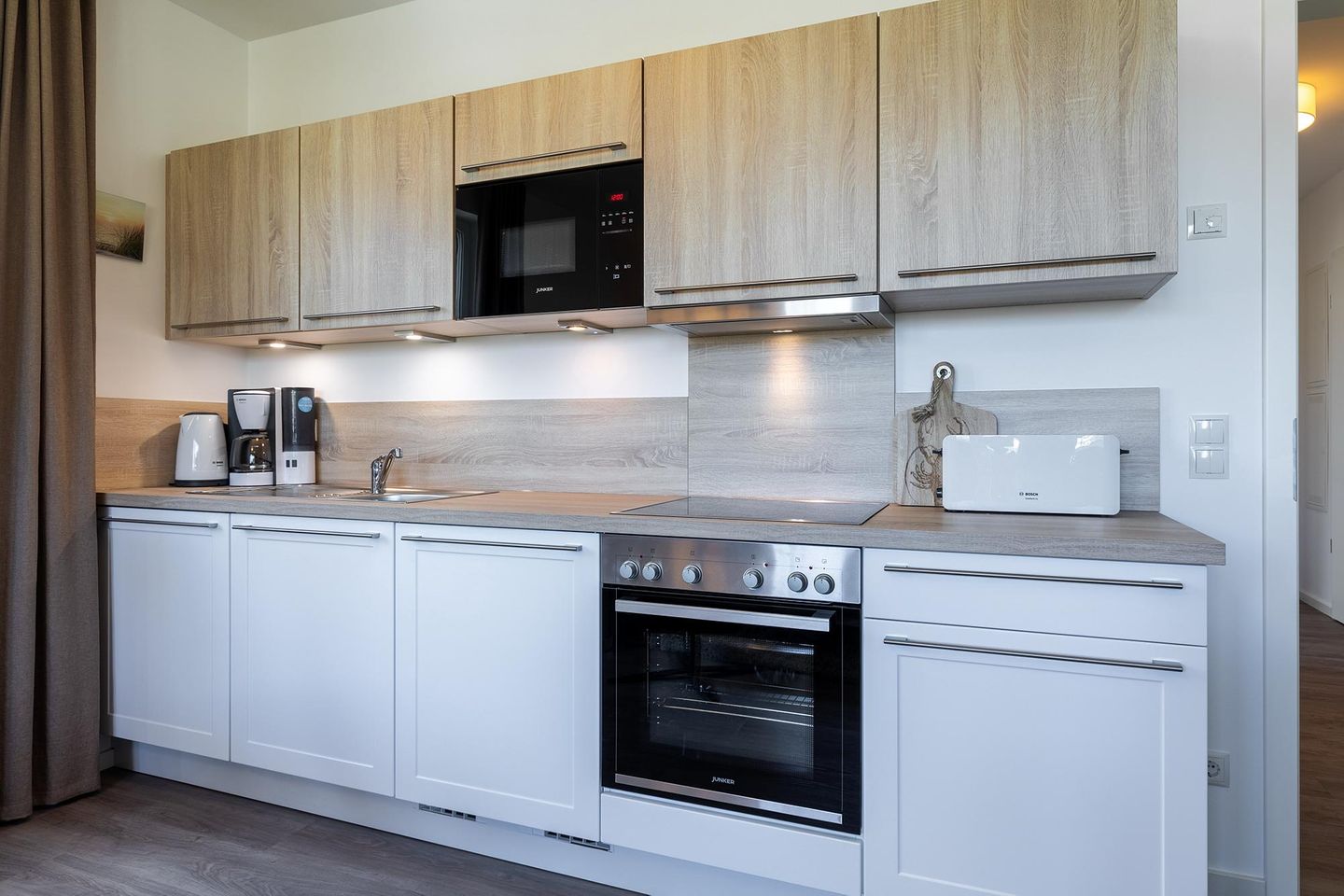 Aparthotel Ostseeallee Aparthotel Ostseeallee 2-15 Boltenhagen - Wohn-/Essbereich mit Küchenzeile