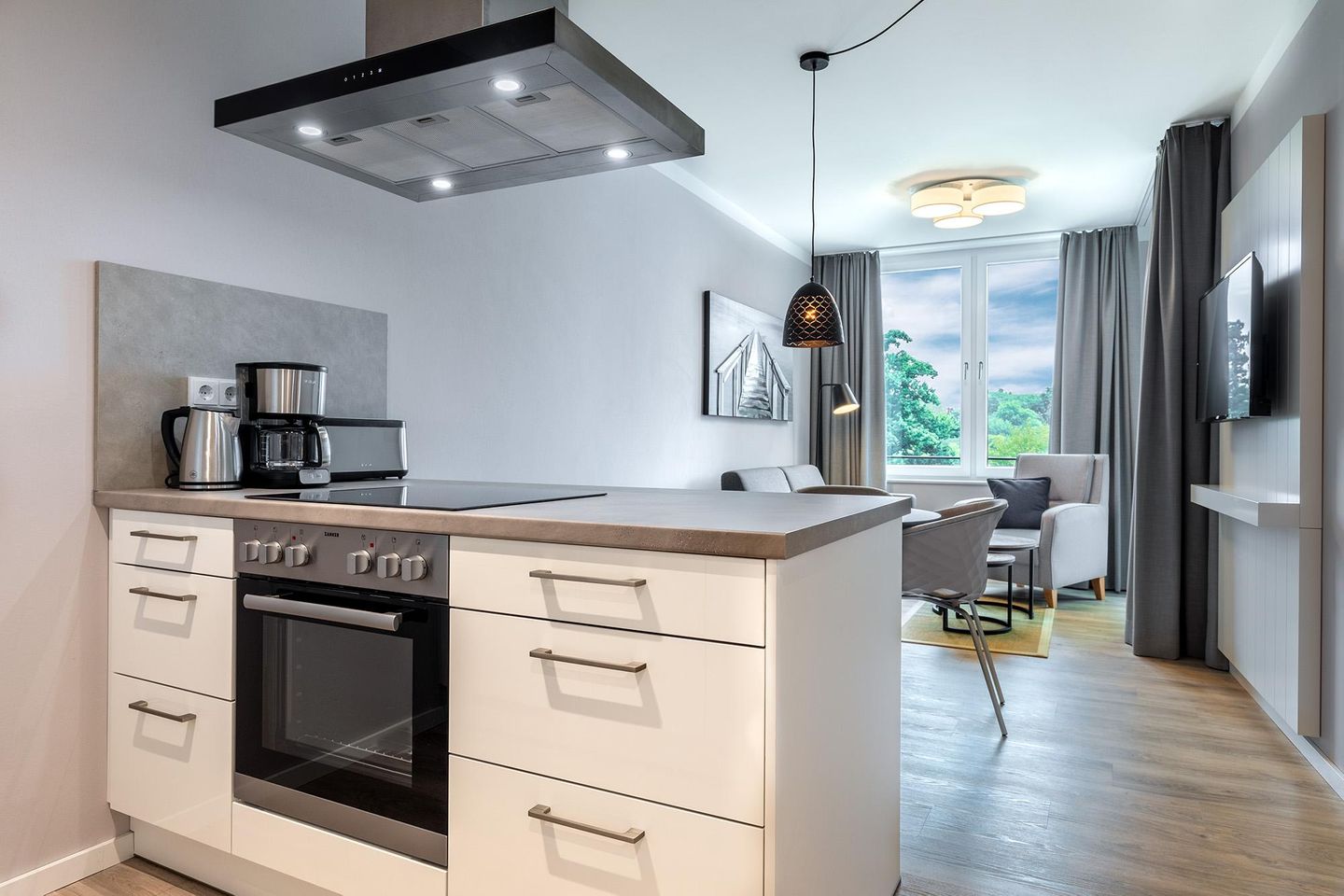 Godewindpark Travemünde Godewindpark Travemünde 3-12 Travemünde - Wohn-Essbereich mit Kochinsel und Sitzgelegenheit