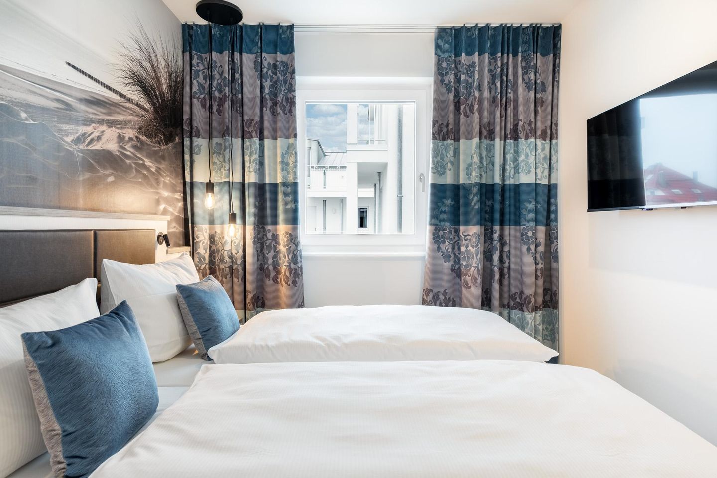 Apartmentanlage Meerblickvilla Apartmentanlage Meerblickvilla 3-34 Großenbrode - Schlafzimmer mit Flatscreen-TV