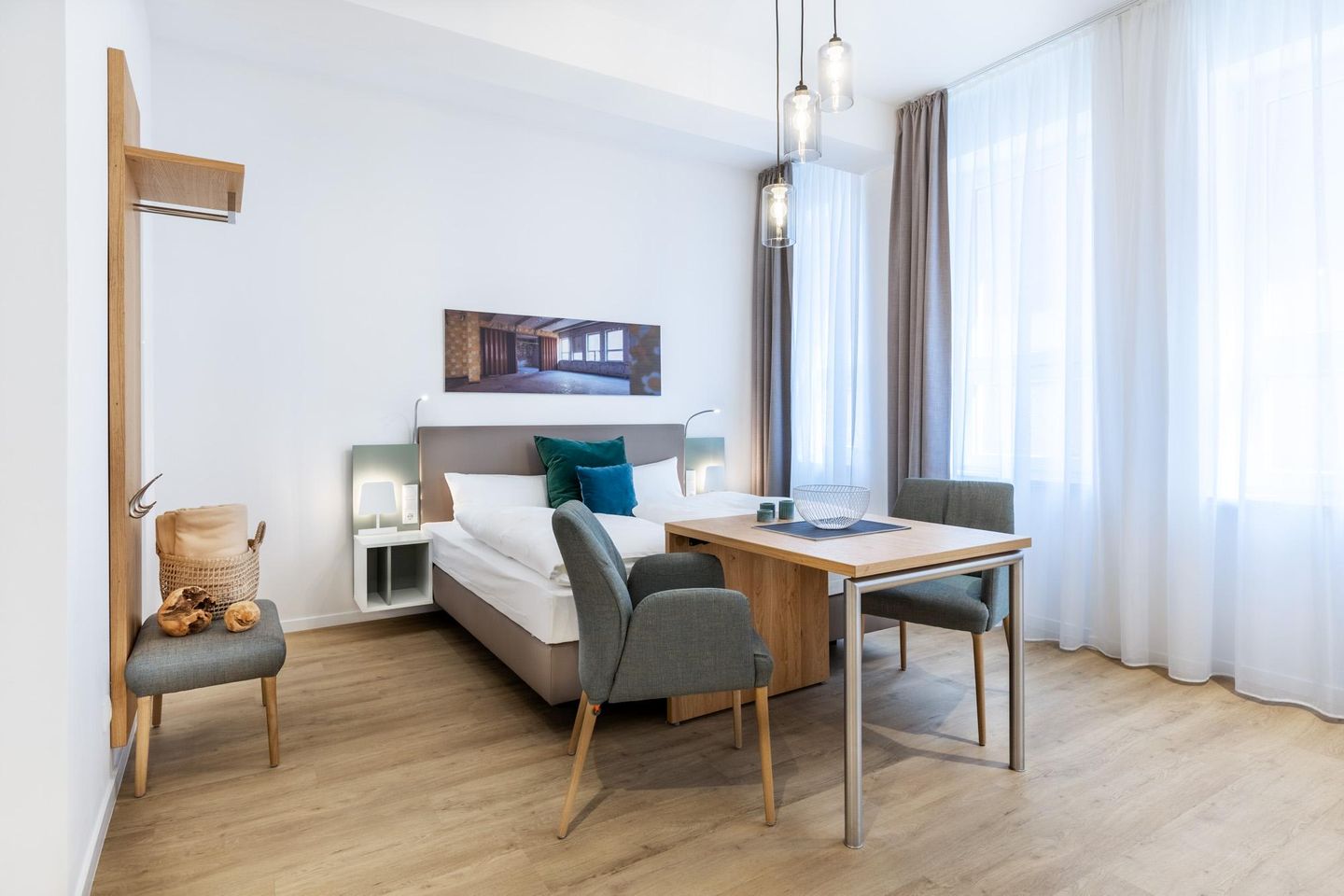 Ferienapartments am Krusespeicher Ferienapartments am Krusespeicher 0-03 Wismar - Wohn-/Schlafbereich mit Sitzgelegenheit