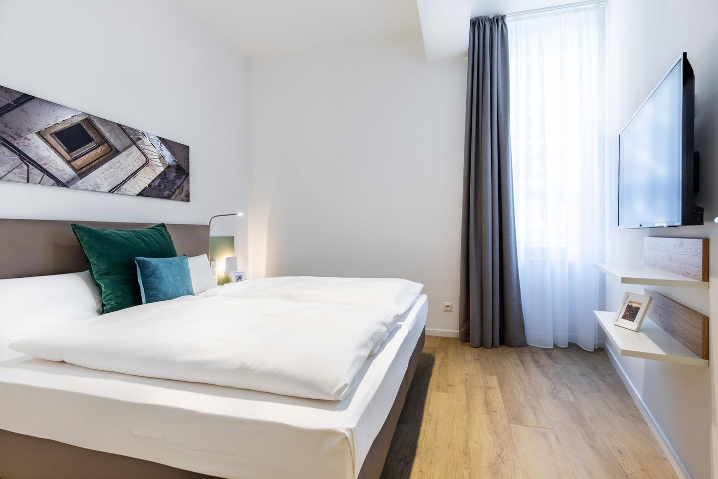 Ferienapartments am Krusespeicher Ferienapartments am Krusespeicher 2-15 Wismar - Schlafzimmer mit Flatscreen-TV