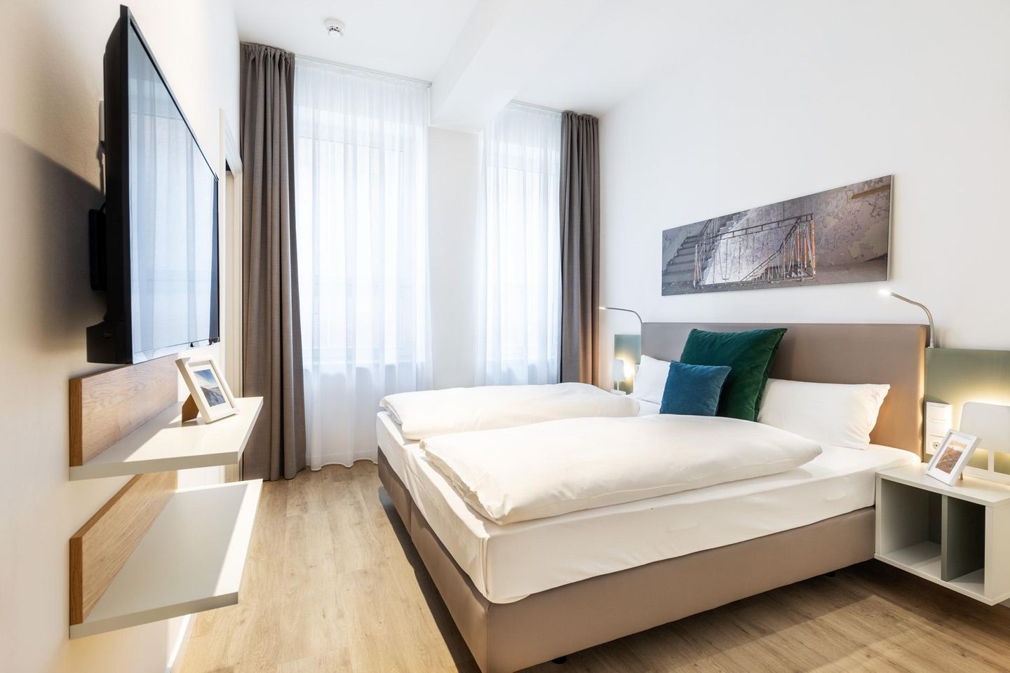 Ferienapartments am Krusespeicher Ferienapartments am Krusespeicher 2-20 Wismar - Schlafzimmer mit Flatscreen-TV