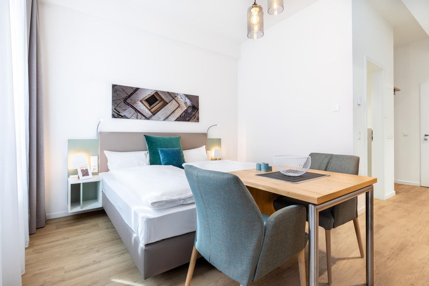 Ferienapartments am Krusespeicher Ferienapartments am Krusespeicher 1-13 Wismar - Wohn-/Schlafbereich mit Sitzgelegenheit