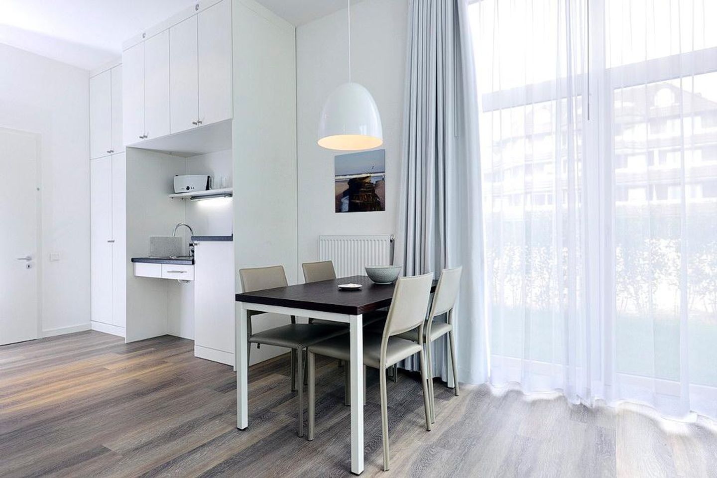 Aparthotel Anna Düne Aparthotel Anna Düne 0-08 Wangerooge - Wohn/ Essbereich mit Esstisch