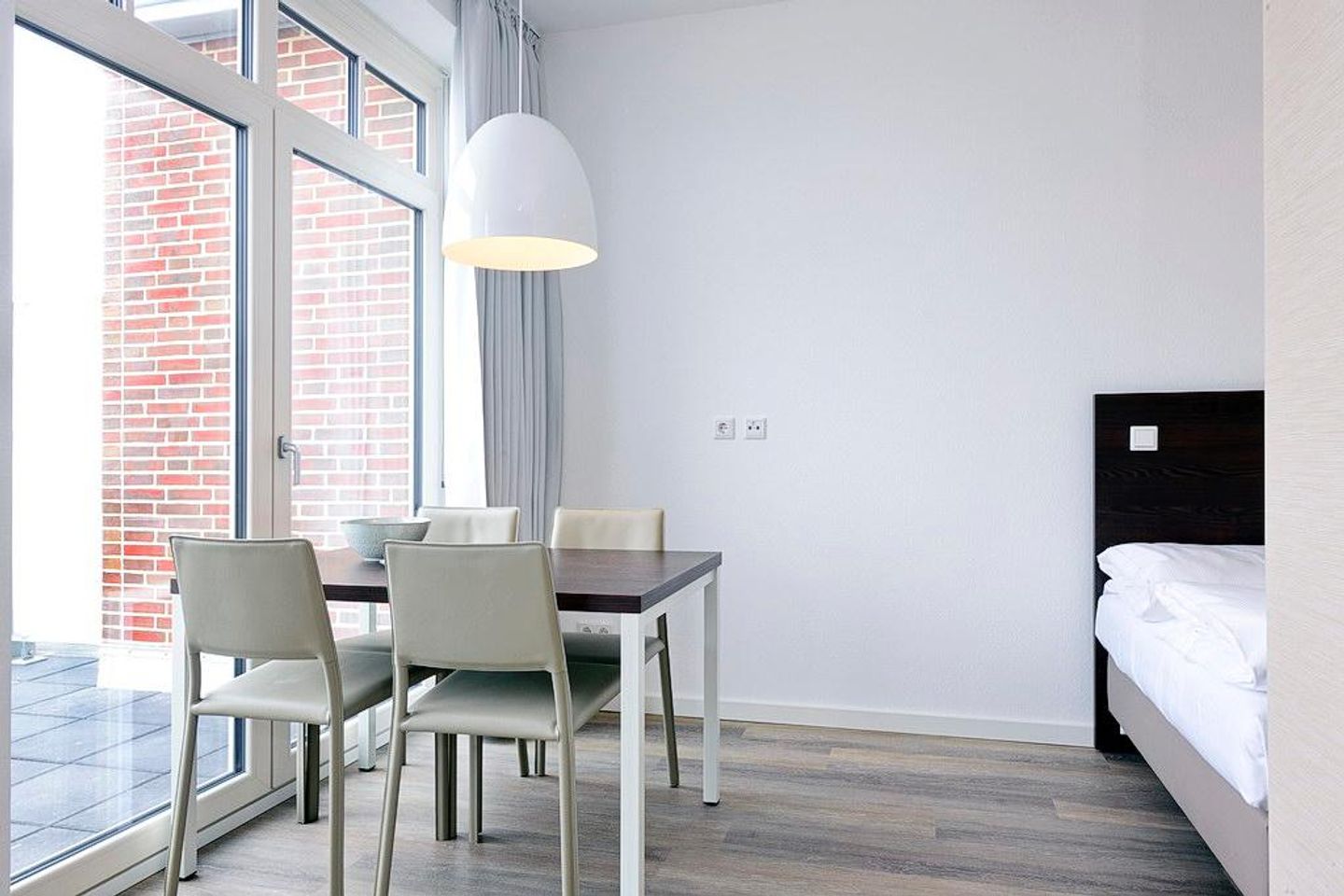 Aparthotel Anna Düne Aparthotel Anna Düne 2-35 Wangerooge - Wohn/ Essbereich mit Esstisch