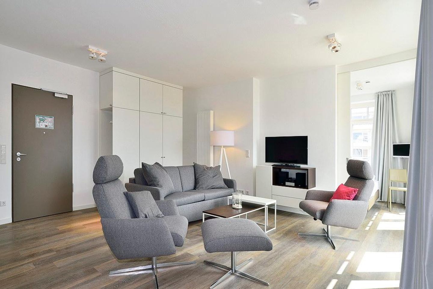 Aparthotel Anna Düne Aparthotel Anna Düne 2-39 Wangerooge - Wohn/ Essbereich mit Fernseher